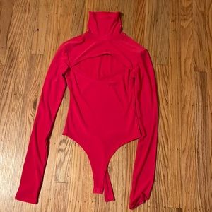 Hot pink turtleneck bodysuit